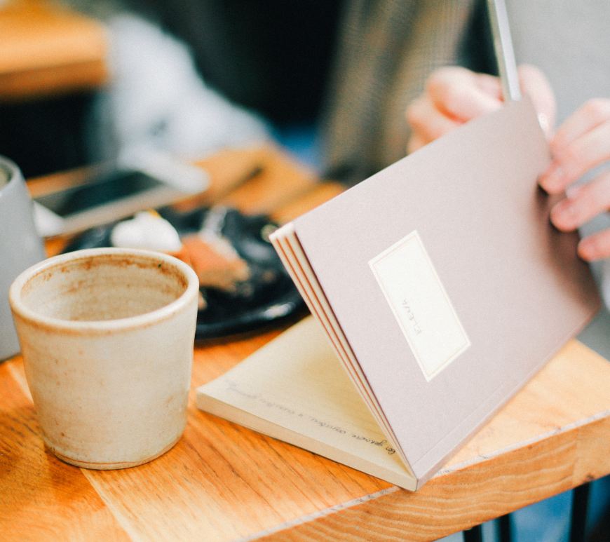 woman writing in a journal