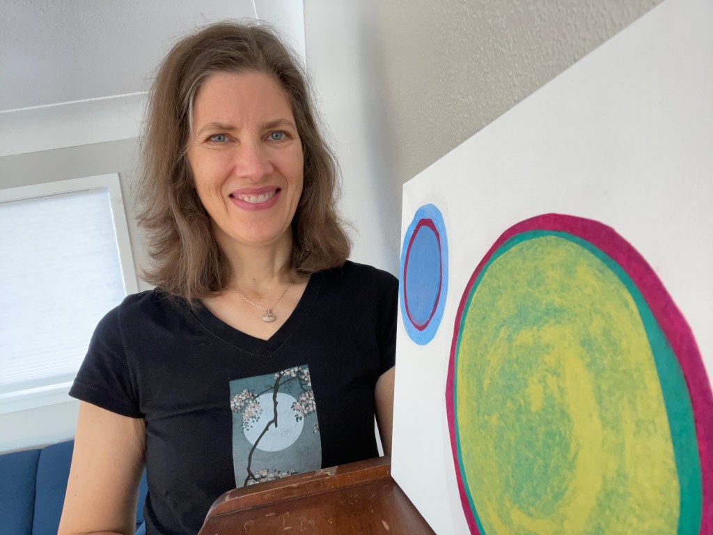 canvas featuring two concentric circles -- one small and blue, one large and red, green and yellow